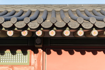 Naklejka premium Traditional korean decor roof of village house In Palace, Seoul, South Korea.