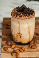 Vegan rice and coconut milk banana smoothie in a jar.