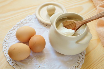Eggs and sour cream in a pot