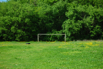 Abandoned old green football pitch
