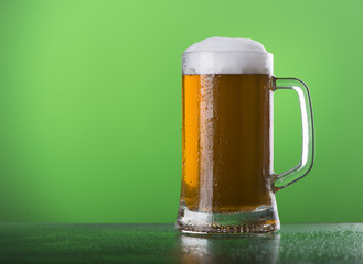 Light beer mug against the backdrop of the bar shelf