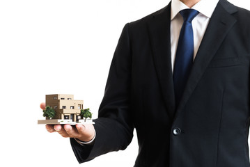 ビジネスマンと家イメージ