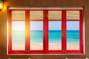 wood windows with sea beach ocean out side.