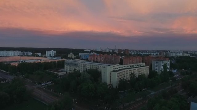 Aerial view, evening view of the city at sunset. 50 fps. View from a height.

