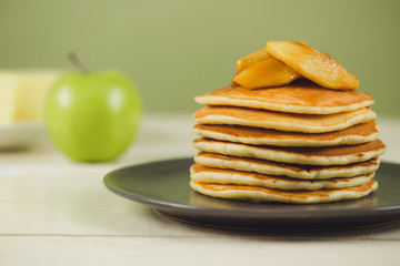 Pancakes with apple on table. Breakfast, snacks. Pancakes Day.