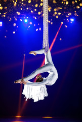 Young woman circus air gymnast