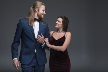 young stylish couple in evening fashion outfit walking together