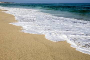 On a beach by the water of the sea, Atlantic Ocean.