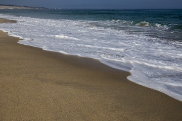On a beach by the water of the sea, Atlantic Ocean.