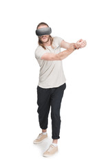 young man playing golf in virtual reality headset, isolated on white