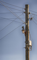 wooden electric pole with antique lantern