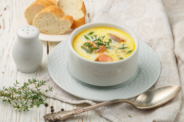 Delicious cream soup with fresh salmon with vegetables and spices. Lunch gourmet