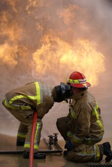 Obraz premium fire-fighters in full fire kit, fire crew