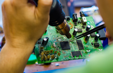 Close-up soldering of chips on the printed circuit board © Nice