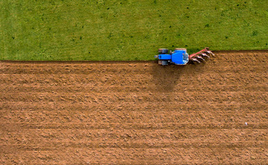 Tractor Ploughing Plowing Field - Aerial Shot