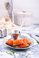 bread with red salmon caviar