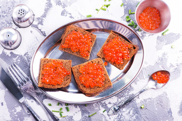 bread with red salmon caviar