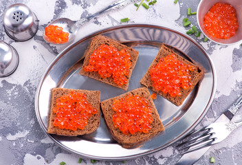 bread with red salmon caviar