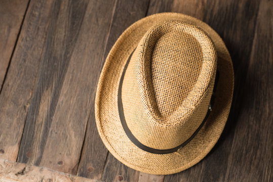 Hat on wood texture travel and vacation time concept