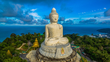Fototapeta premium aerial photography white great Phuket’s big Buddha in blue sky.