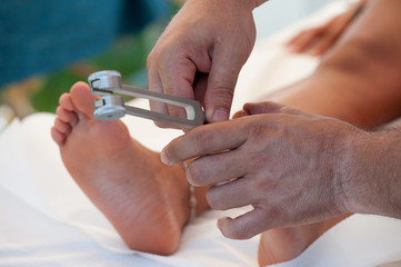 A plantar reflexology session with the tuning fork