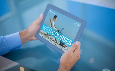 Composite 3d image of businessman using his tablet 