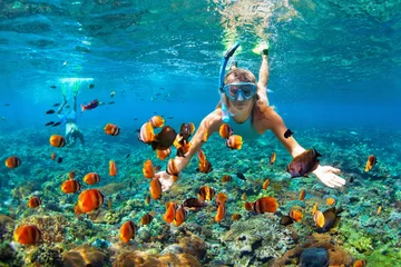 Foto op Aluminium Happy family - couple in snorkeling masks dive deep underwater with tropical fishes in coral reef sea pool. Travel lifestyle, outdoor water sport adventure, swimming lessons on summer beach holiday © Tropical studio