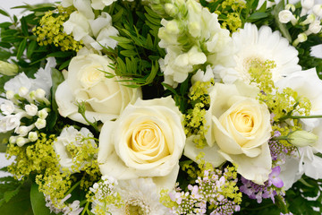 bunch of flowers with white roses