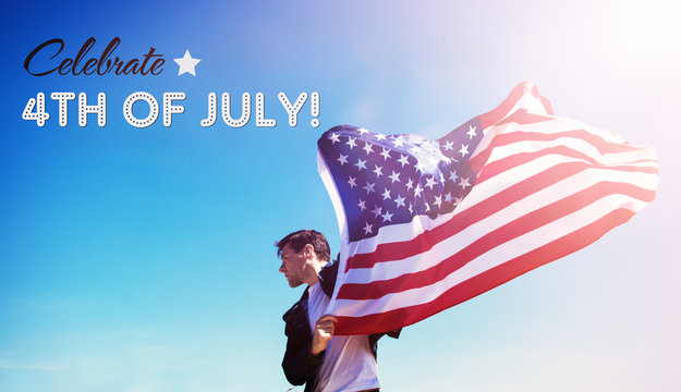 Happy 4Th Of July card. man is holding waving american USA flag, toned image 