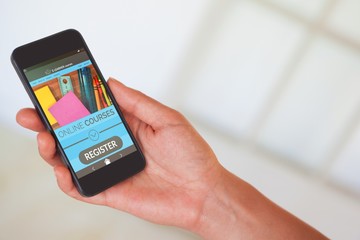 Composite 3d image of womans hand holding black smartphone