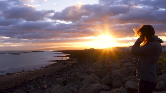Beautiful woman in Icelandic landscape on a sunset