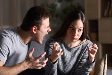 Couple arguing and shouting at home