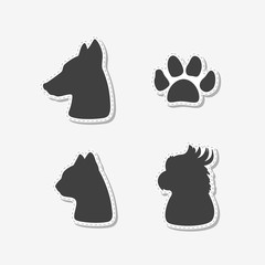 Set of hand drawn stickers with heads of dog, cat, parrot and paw print. Templates for design or brand identity