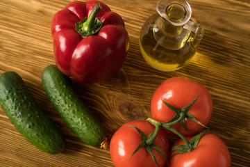 Salad ingridients. Tomato, olive, oil, paprika and cucumber.