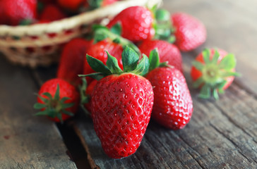 fresh strawberries on a wooden background