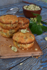 Homemade sweet muffins with white mulberry. Berry cupcakes on a wooden background.