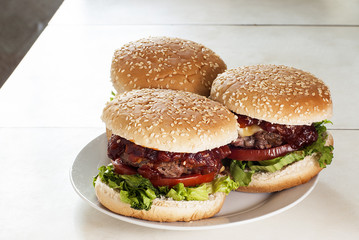 Three hamburgers in the kitchen