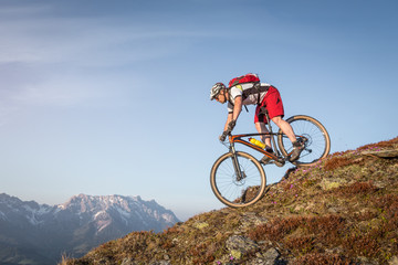 Male mountainbiker on a trail in the mountains