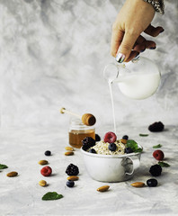Healthy breakfast with oat flakes, raspberry berries, blueberries, selective focus