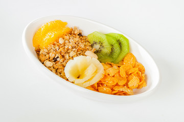 A light breakfast of fruit and cereal. Kiwi orange and pineapple. Light dessert of fruit.