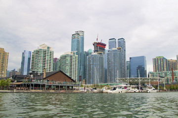 Fototapeta na wymiar Cityscape along the harbor waterfront district in Toronto Ontario Canada