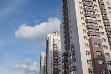 living tower houses with blue sky background