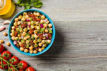 Chickpeas salad with onion and dried tomatoes.