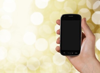 Hand holds phone.