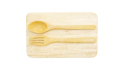 Wooden spoon and fork on a wooden plate.