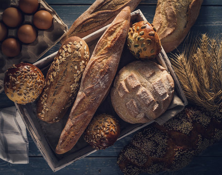 Different Kinds Of Bread On Background.