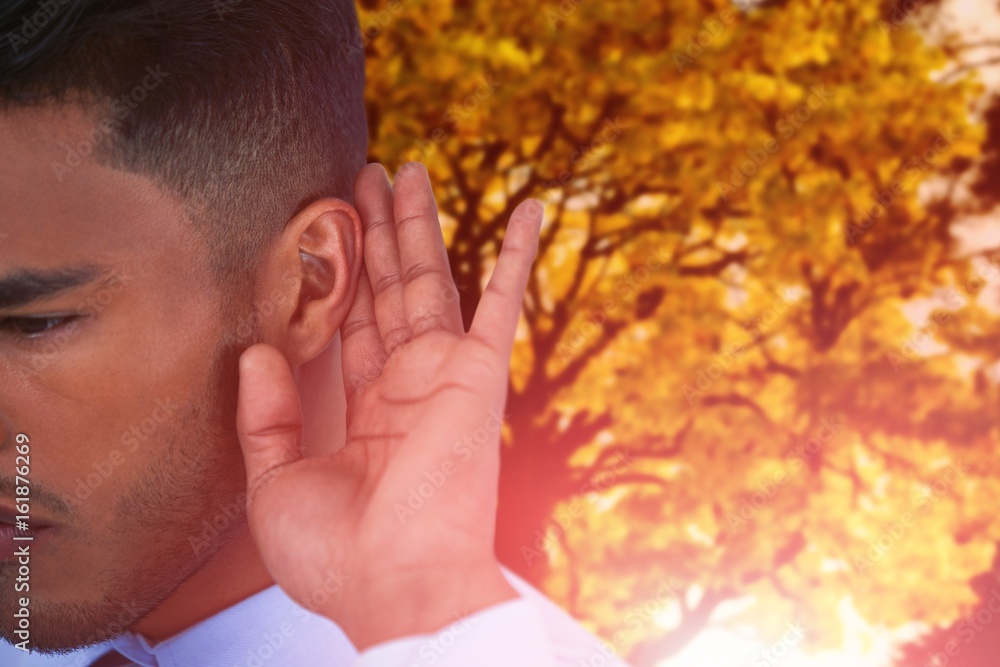 Poster composite image of close up of businessman trying to listen