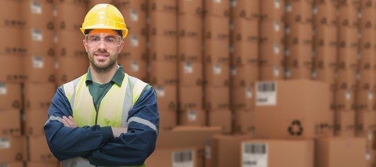Composite image of manual worker wearing hardhat and eyewear