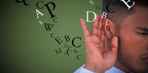 Composite image of close up of businessman trying to listen