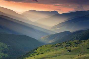 Summer sunrise landscape in the Carpathians Mountains, on Transalpina mountain road, Romania